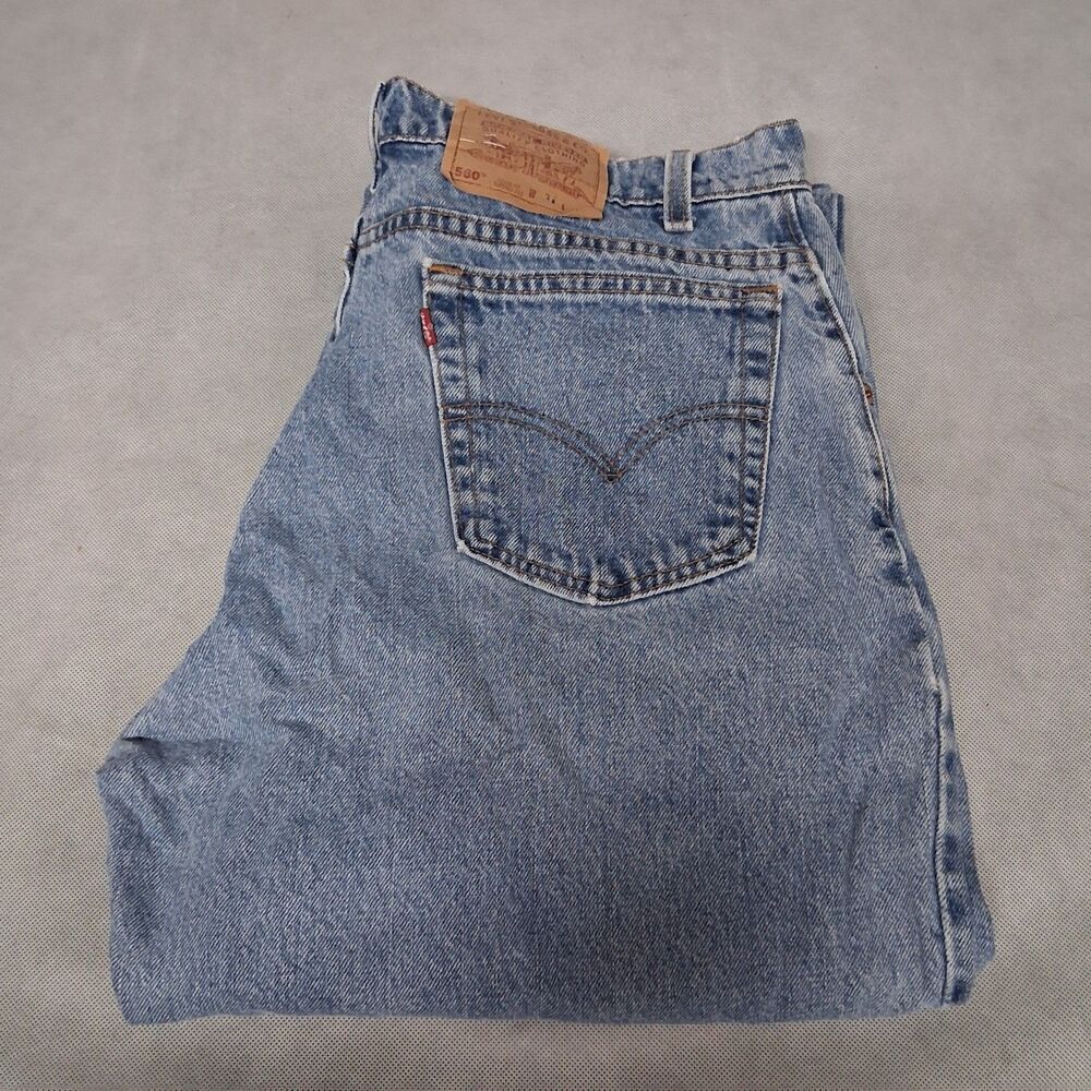 90's Levi's 560 Blue Jeans 33x34 Loose Fit Light Washed Tapered Leg Made in USA